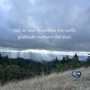Dark clouds and streams of rain with gratitude quote
