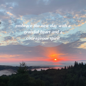 Photo of sunrise with quote "embrace the new day with a grateful heart and a courageous spirit